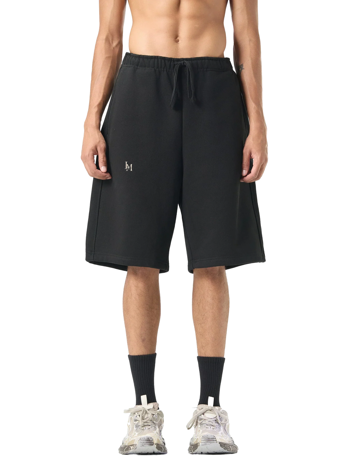 The Fleece Short in Black — on model, front #Color_Black