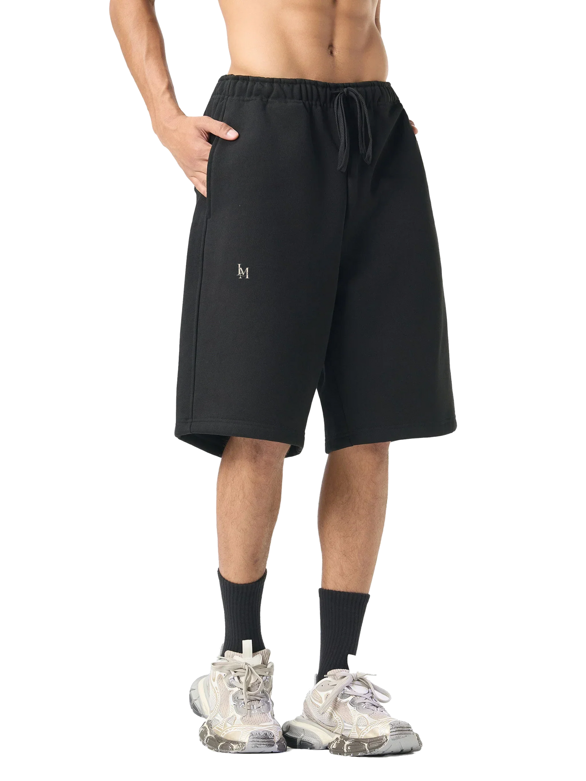 The Fleece Short in Black — on model, front #Color_Black