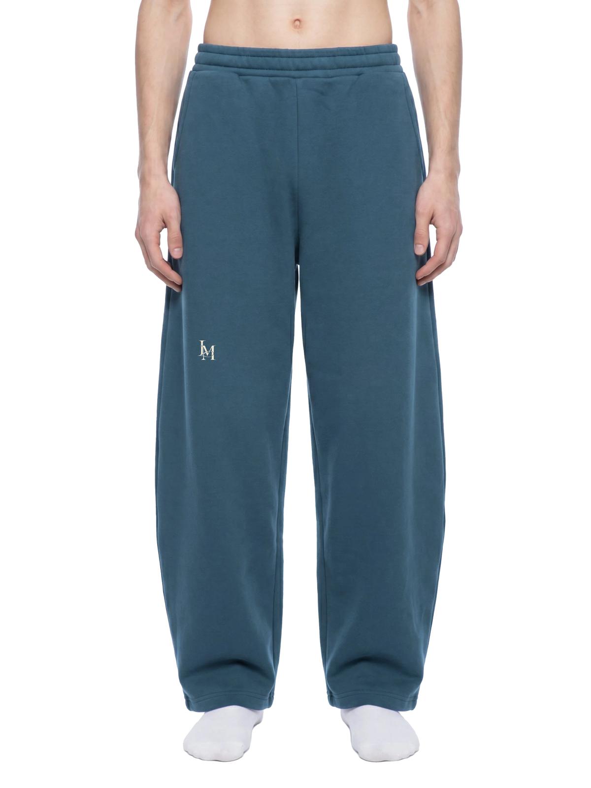 The Barrel Sweatpant in Navy Blue — on model, front #Color_Navy Blue