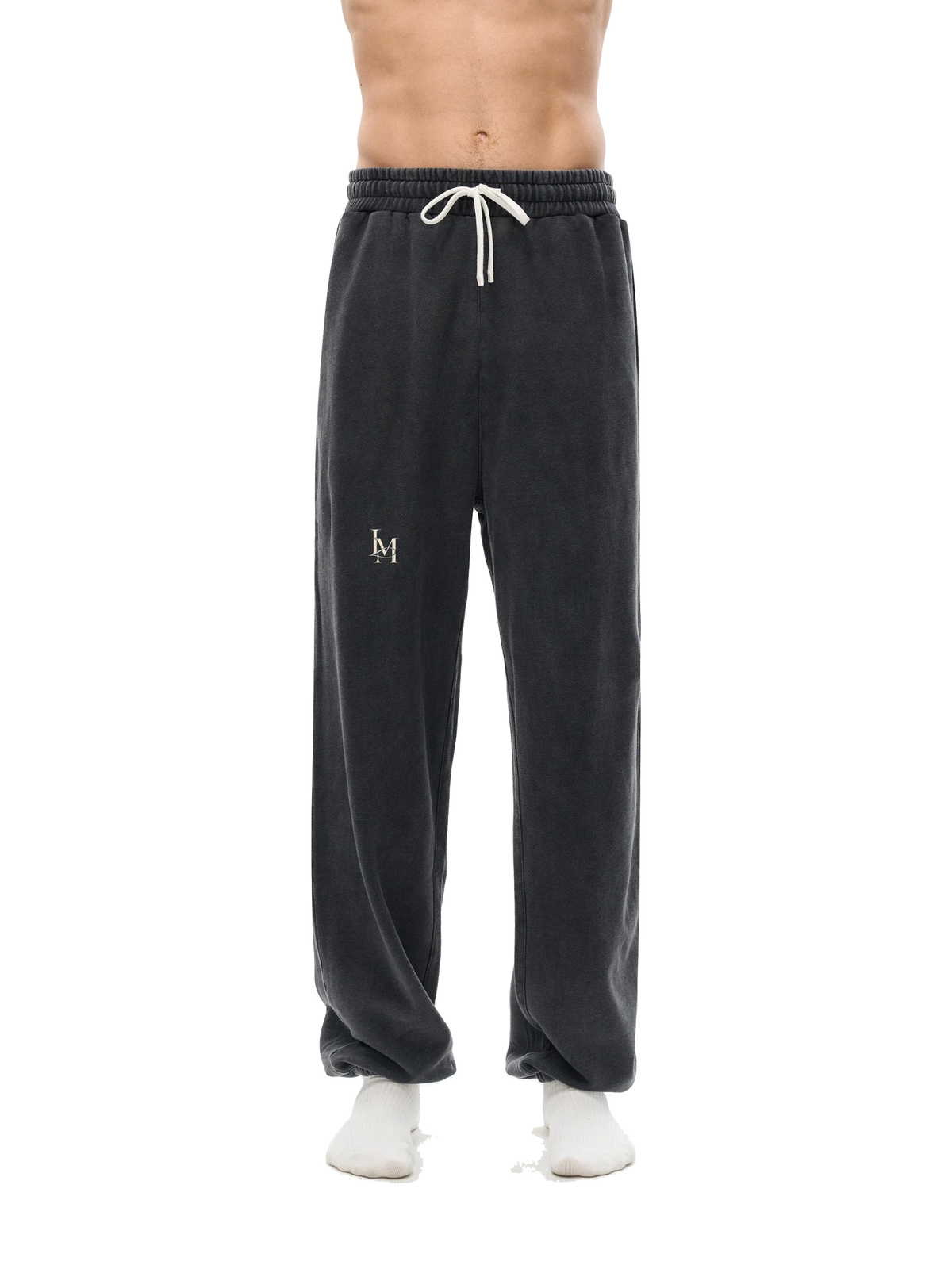 The Washed Sweatpant in Black — on model, front #Color_Black